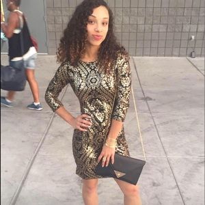 Black and gold sequin dress